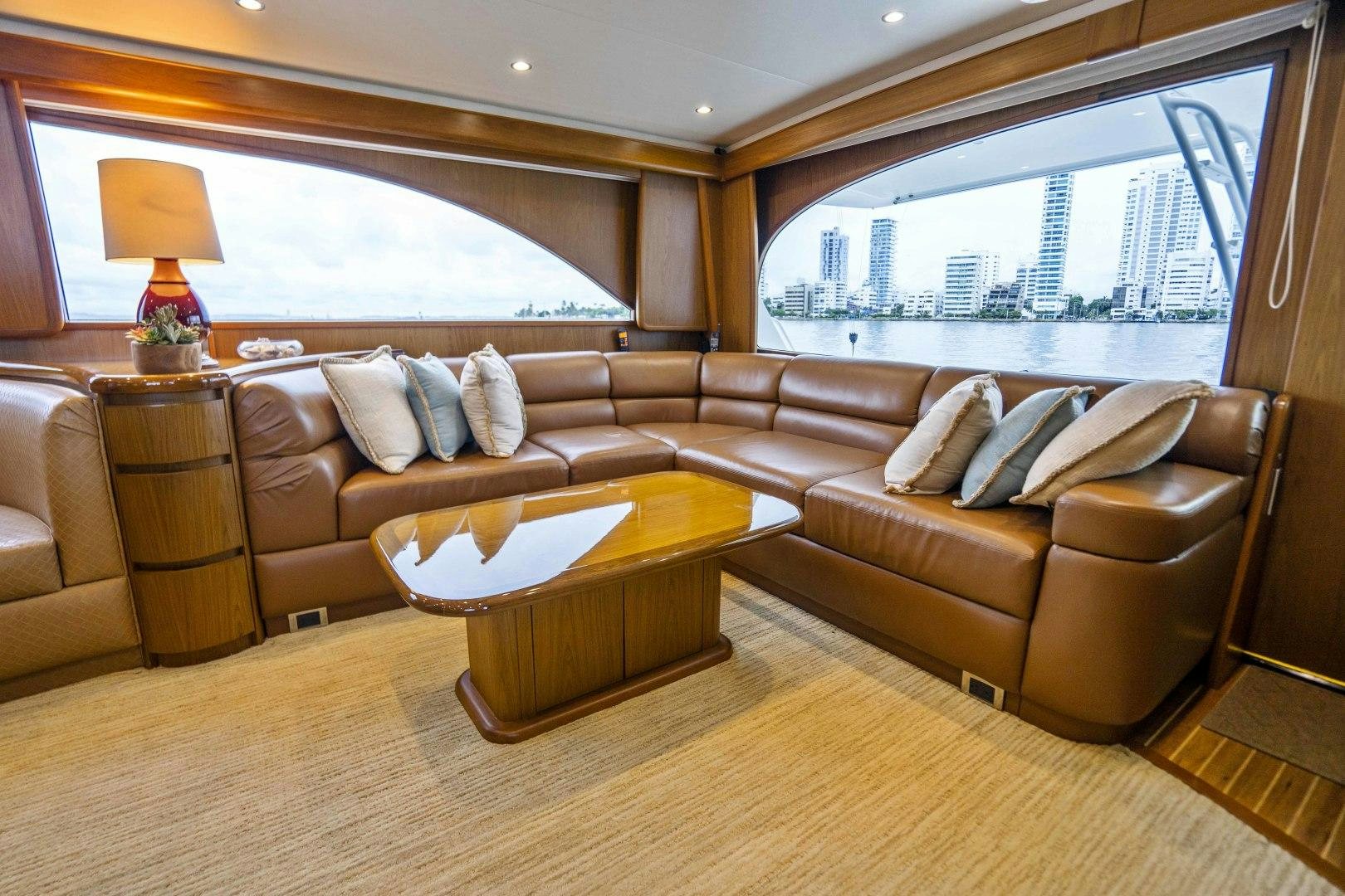 a living room with a large window aboard LAST CALL Yacht for Sale