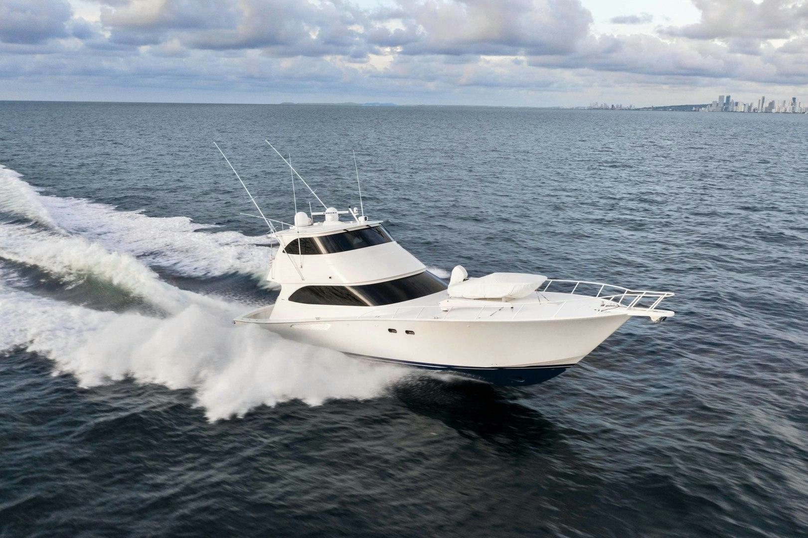 a white yacht on the water aboard LAST CALL Yacht for Sale