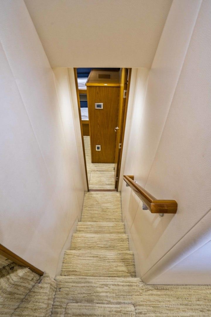 a hallway with a door aboard LAST CALL Yacht for Sale
