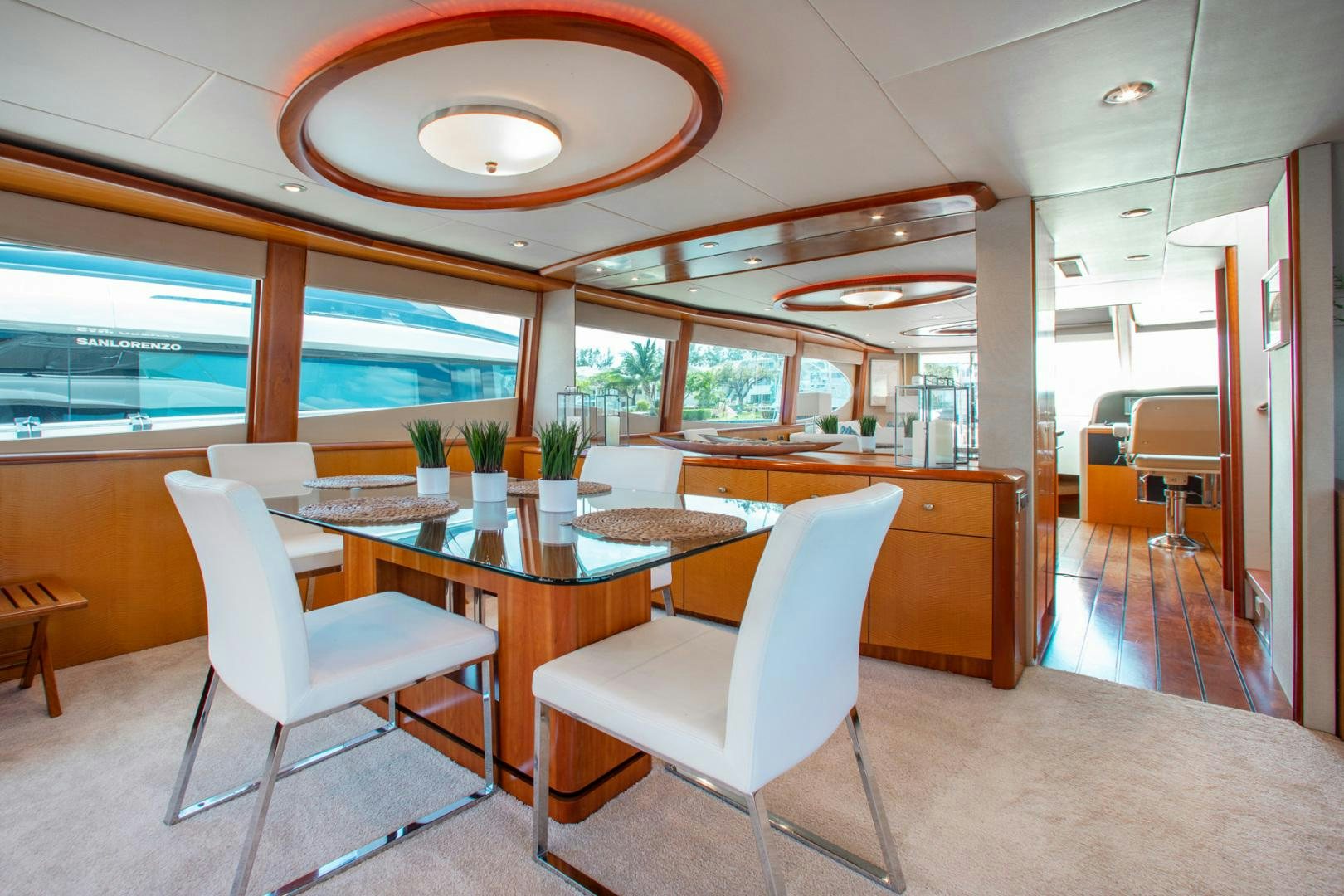 a room with a table and chairs aboard 26 NORTH Yacht for Sale