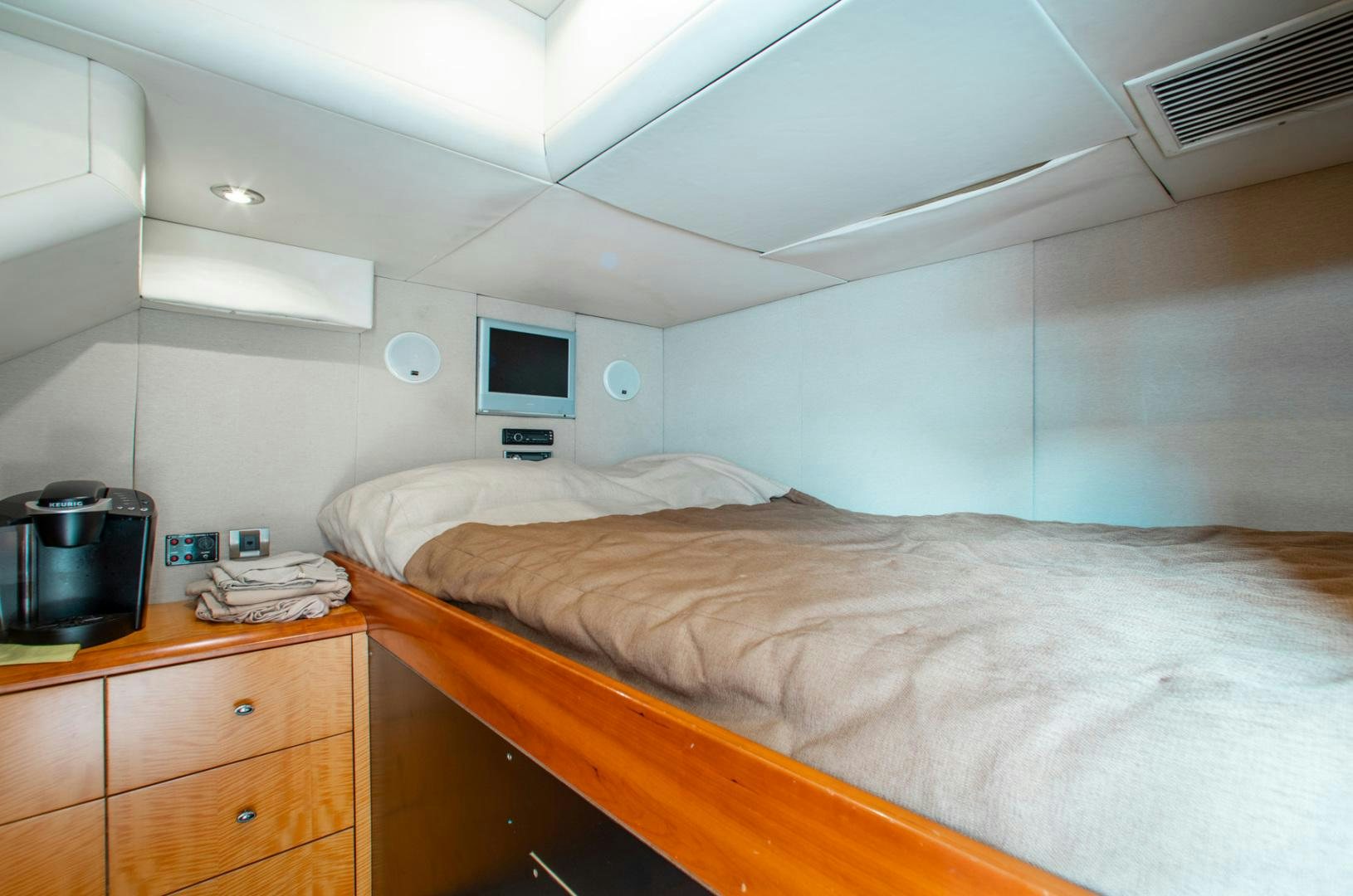 a room with two beds aboard 26 NORTH Yacht for Sale