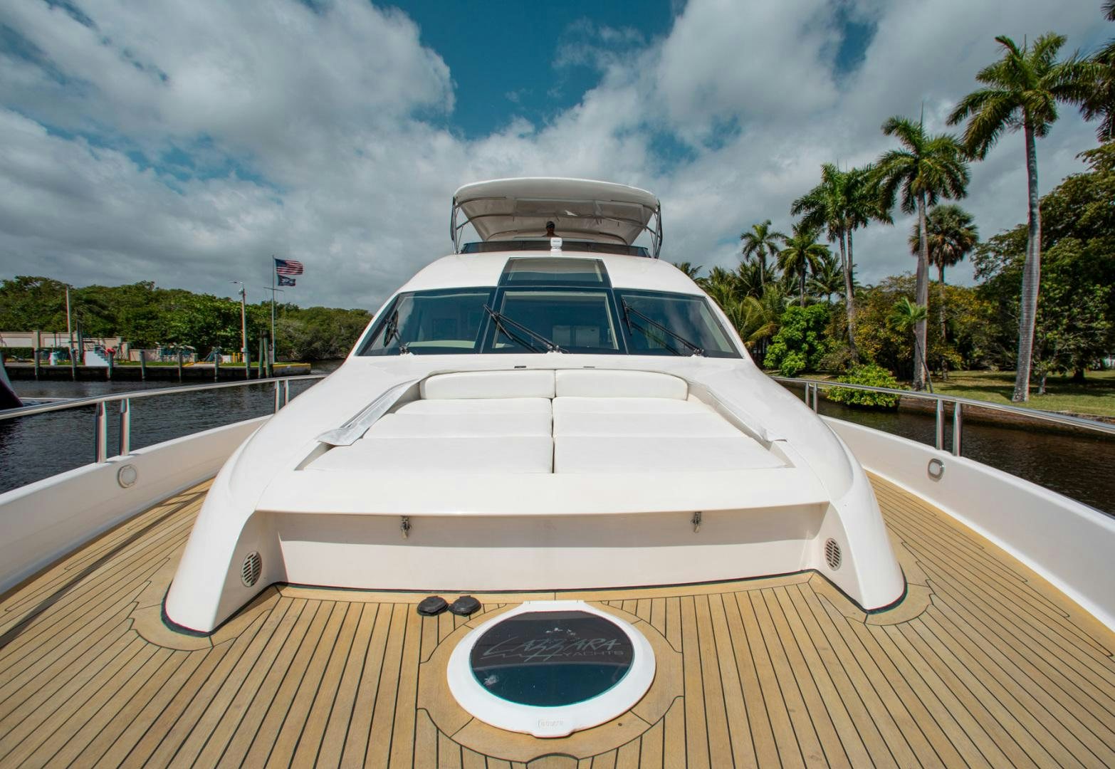 a white car on a dock aboard 26 NORTH Yacht for Sale