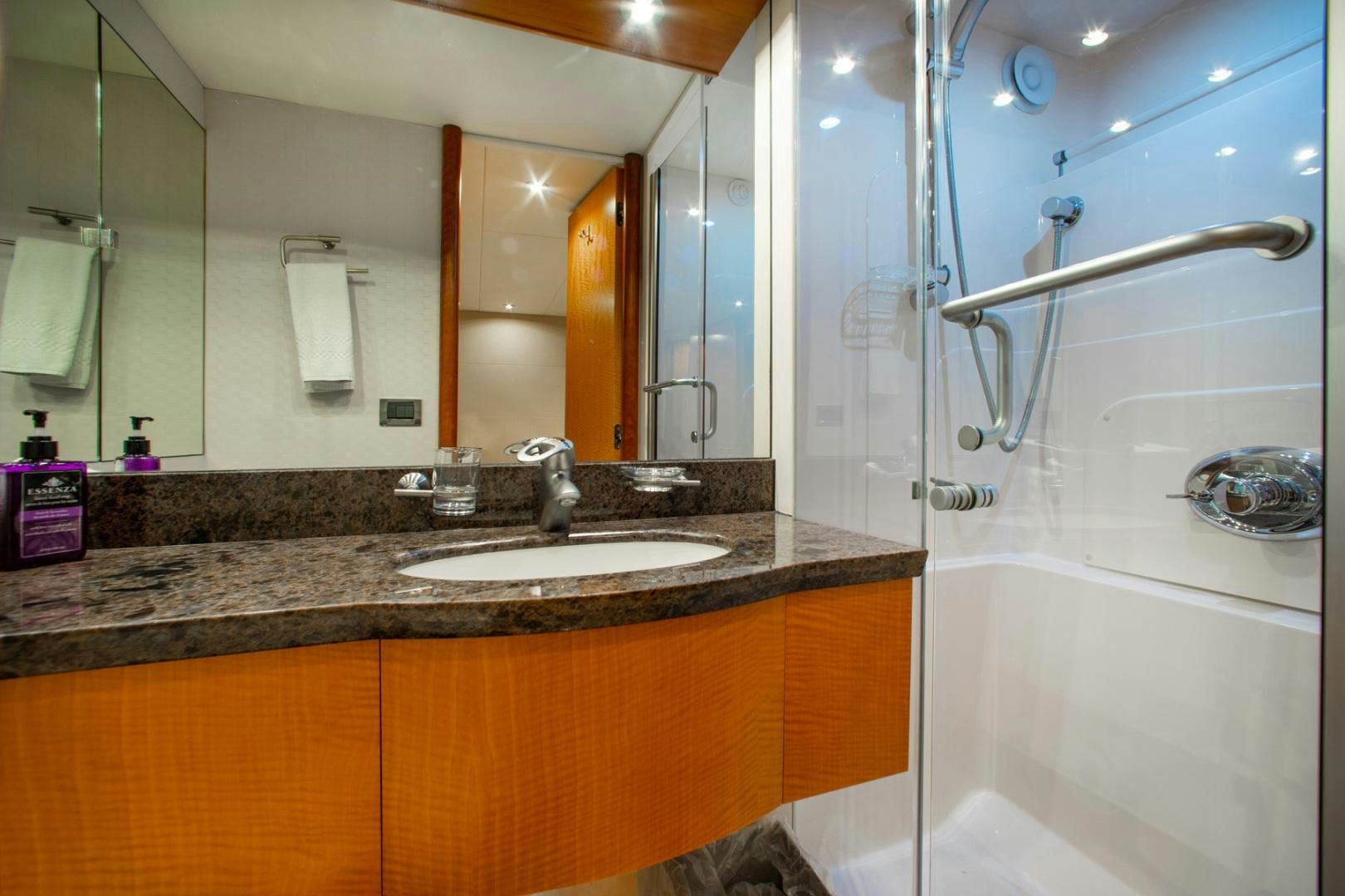 a bathroom with a glass shower aboard 26 NORTH Yacht for Sale