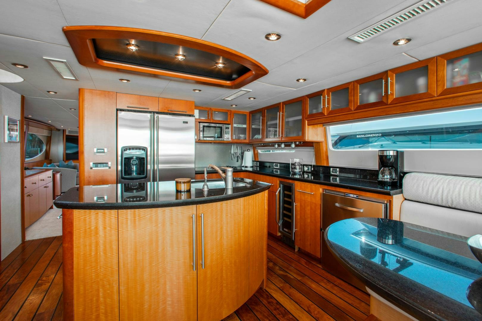a kitchen with a large island aboard 26 NORTH Yacht for Sale