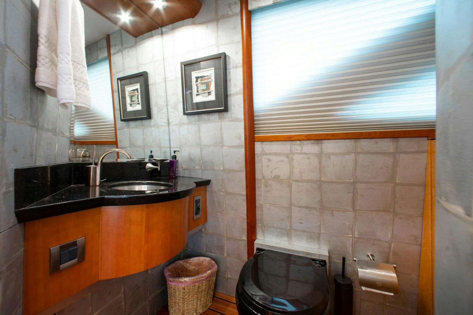 a bathroom with a sink and a window aboard 26 NORTH Yacht for Sale