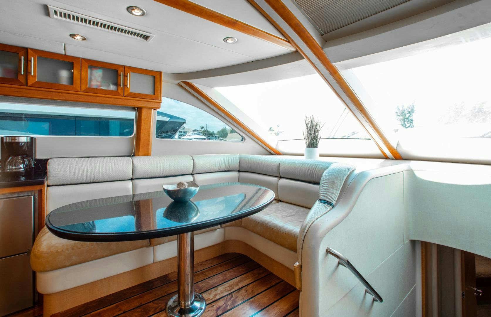 a living room with a couch and a table aboard 26 NORTH Yacht for Sale