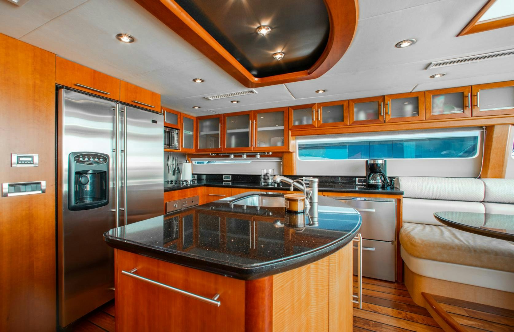 a kitchen with a large island aboard 26 NORTH Yacht for Sale