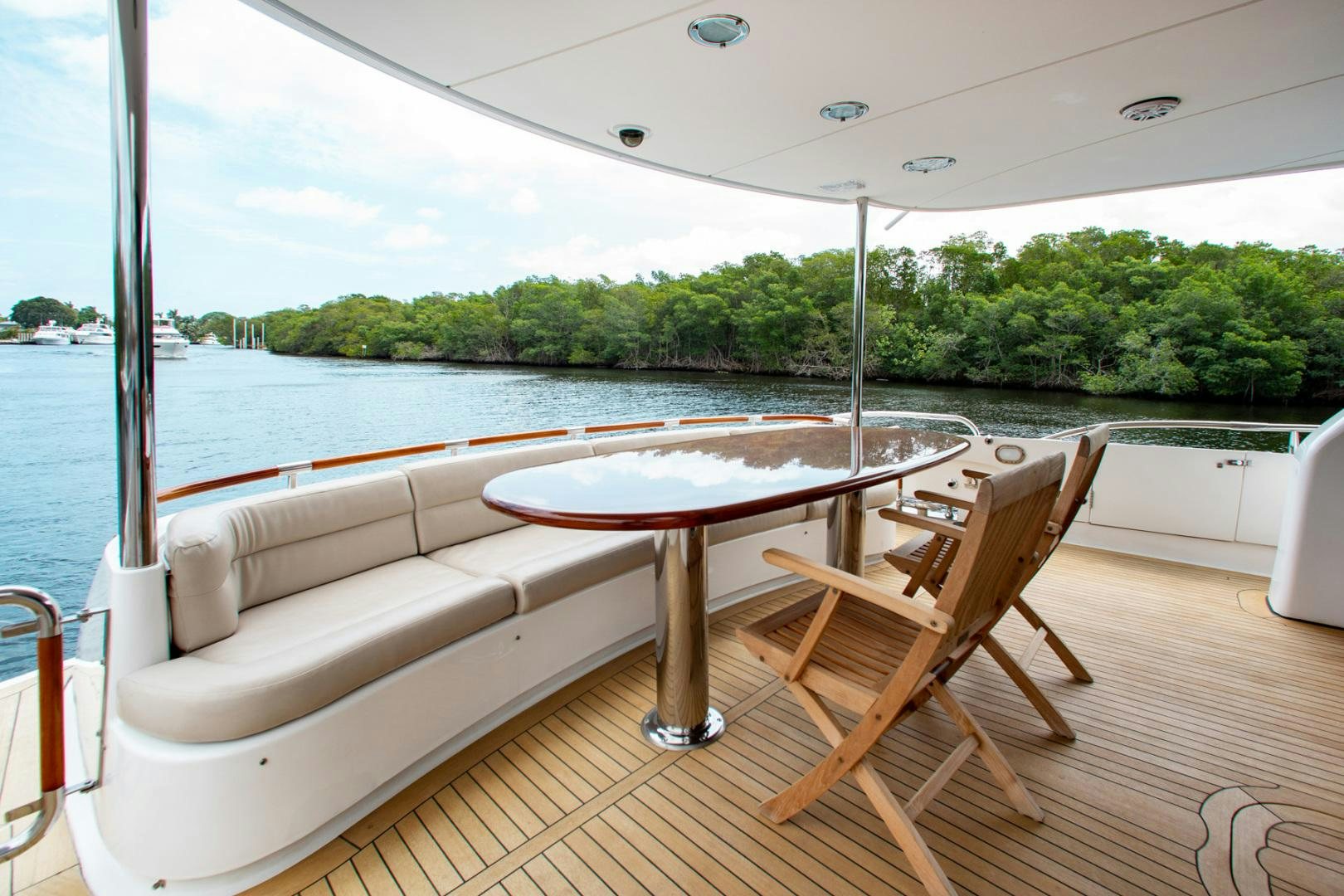 a table and chairs on a boat aboard 26 NORTH Yacht for Sale