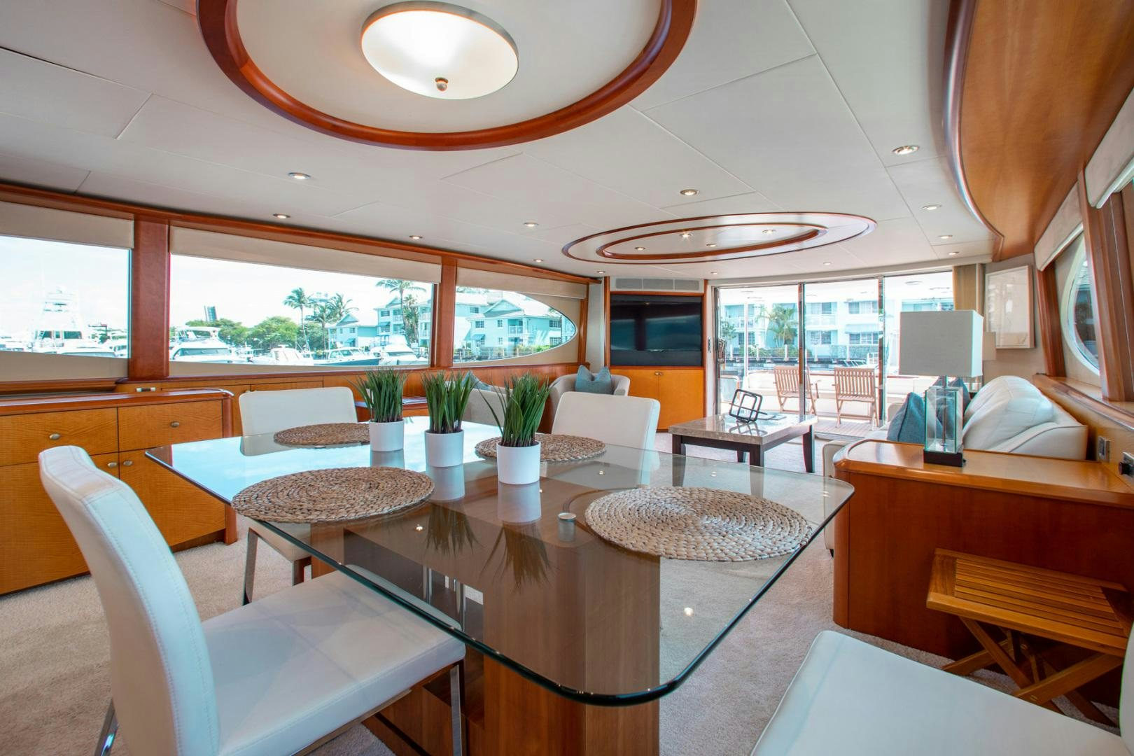 a room with a table chairs and a window aboard 26 NORTH Yacht for Sale