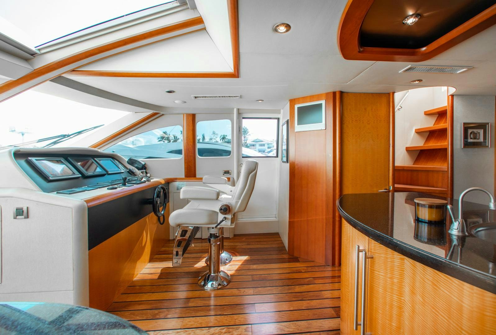 a small room with a bunk bed and a table aboard 26 NORTH Yacht for Sale