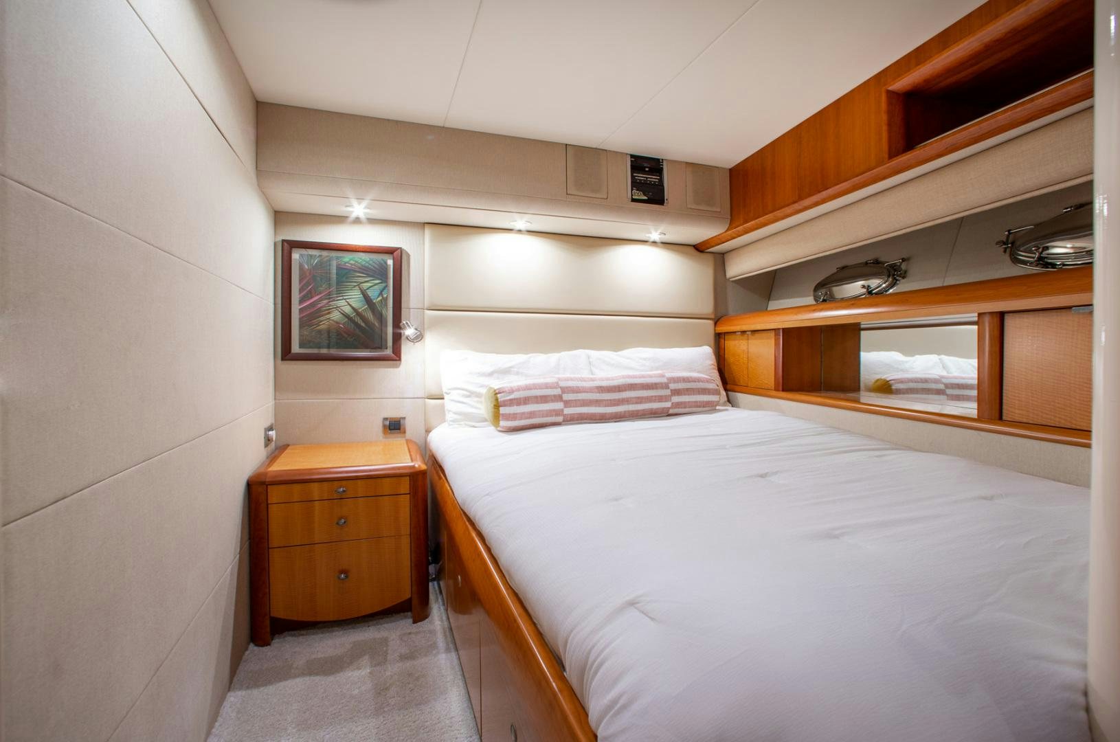 a room with a bed and a dresser aboard 26 NORTH Yacht for Sale