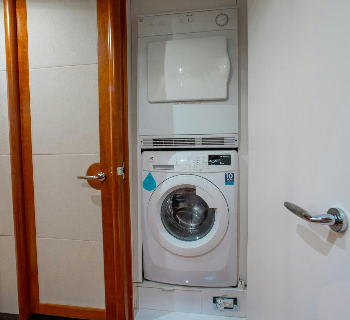 a washer and dryer in a room aboard 26 NORTH Yacht for Sale