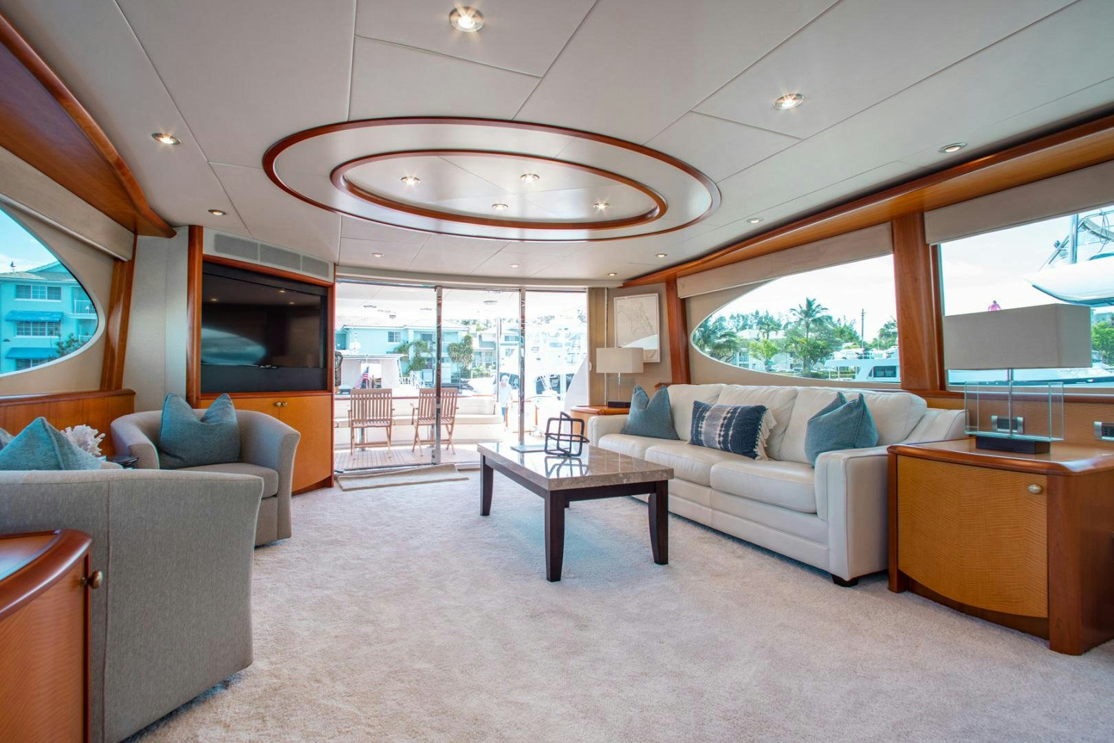 a living room with a large glass ceiling aboard 26 NORTH Yacht for Sale