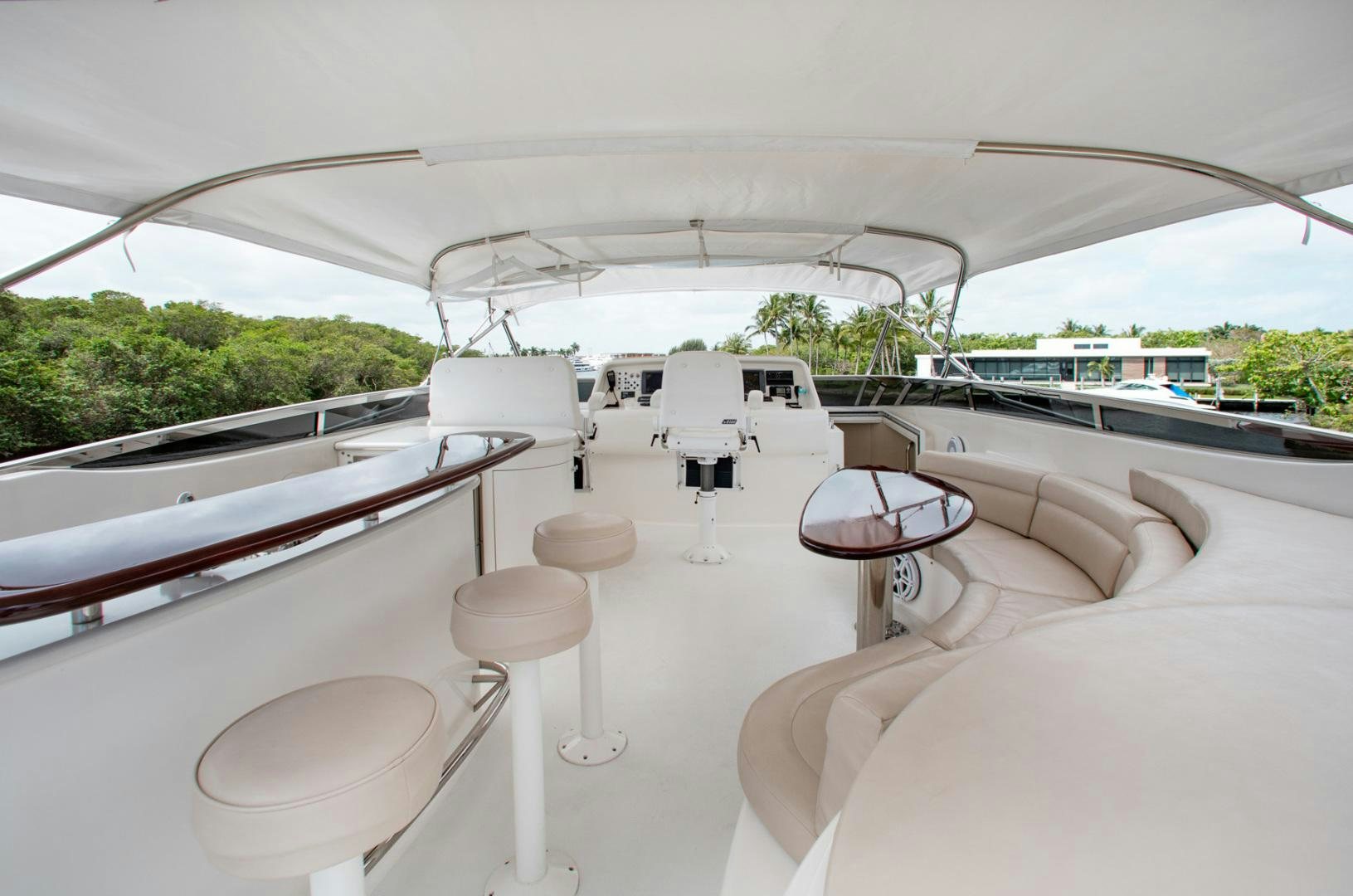 a white tent with chairs and tables aboard 26 NORTH Yacht for Sale