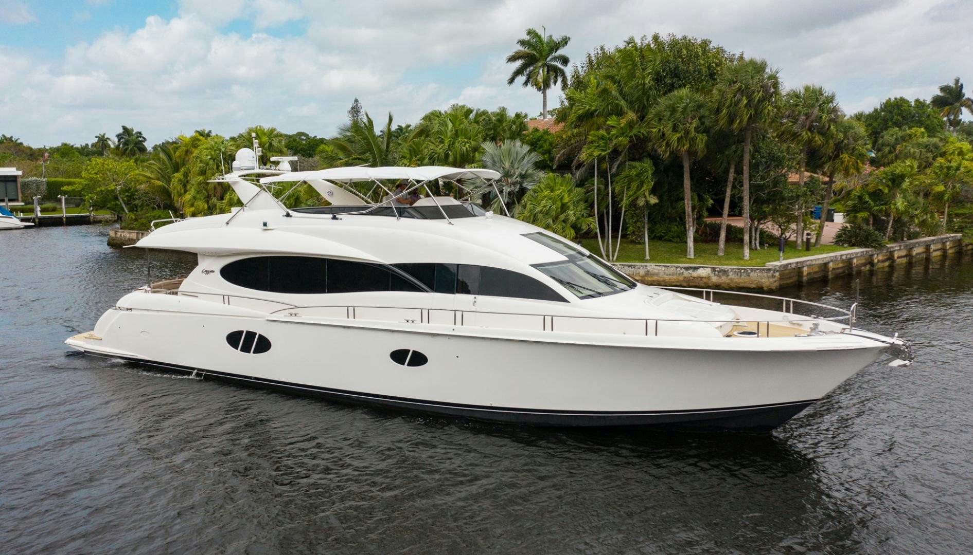 a white yacht on a river aboard 26 NORTH Yacht for Sale