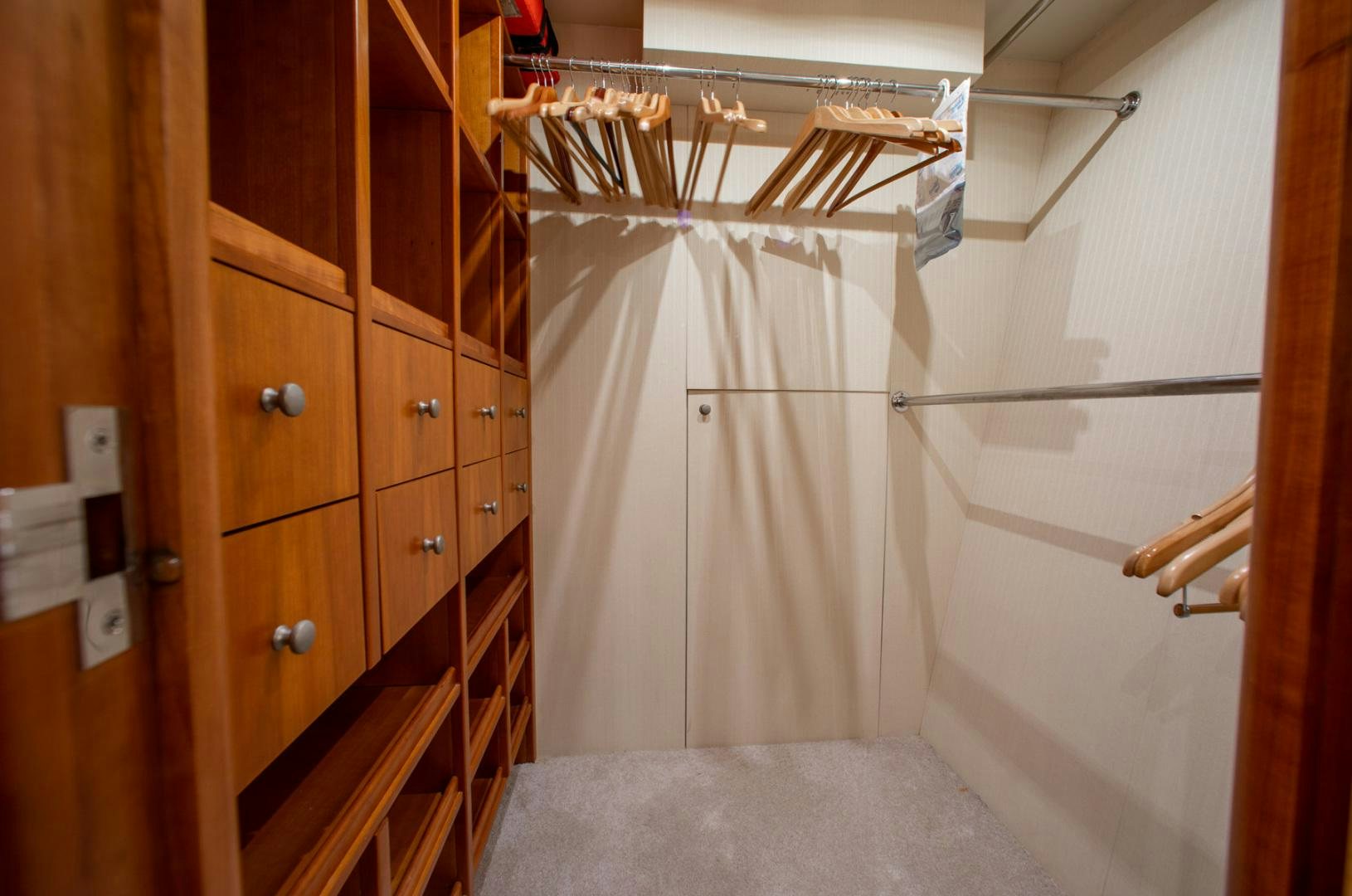 a room with wooden cabinets aboard 26 NORTH Yacht for Sale