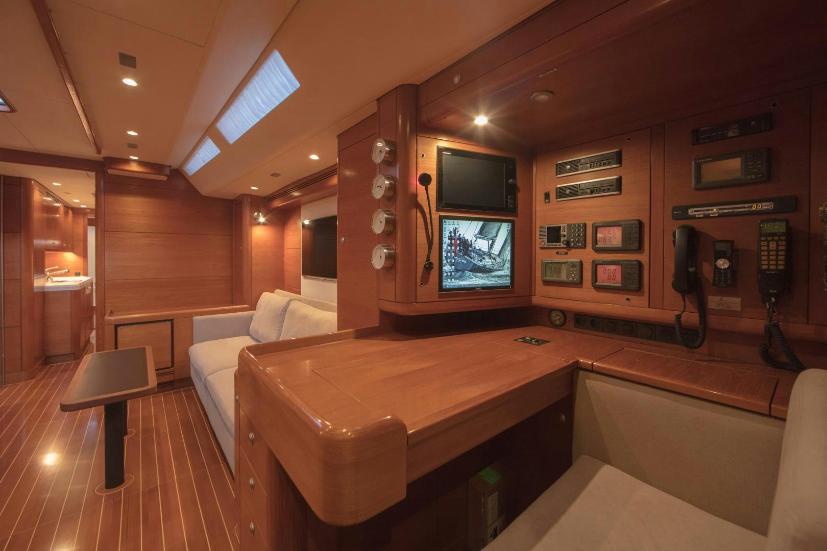 a room with a bed and a television aboard GREY GOOSE Yacht for Sale