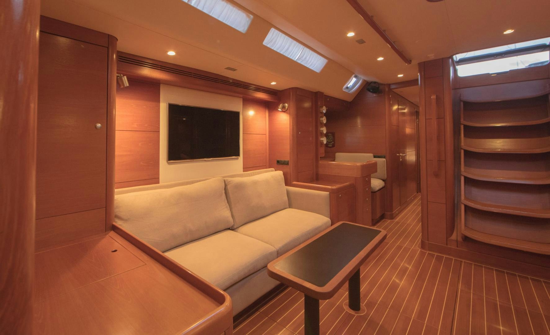 a room with a couch and a tv aboard GREY GOOSE Yacht for Sale
