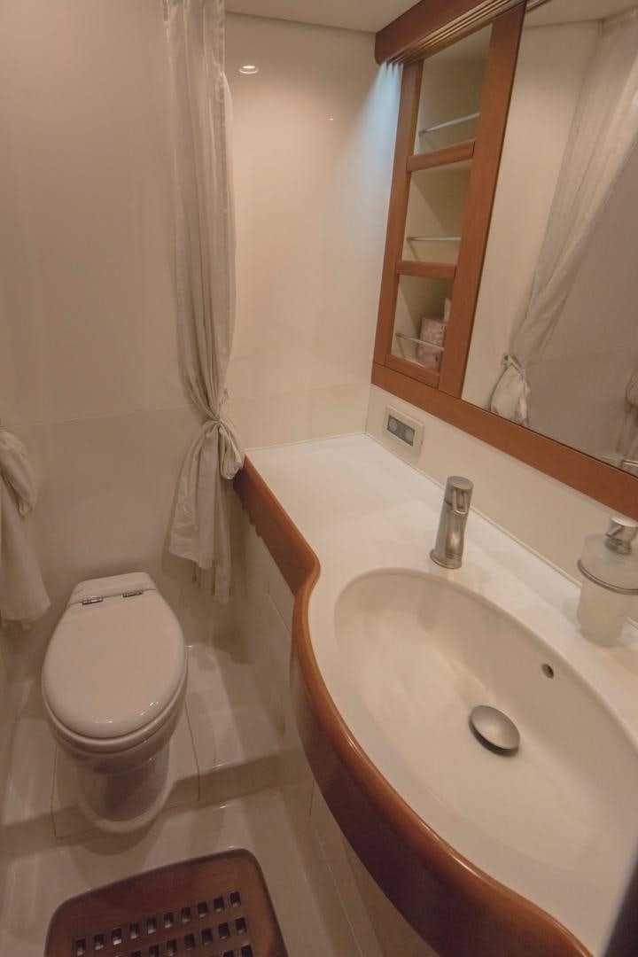a bathroom with a sink and toilet aboard GREY GOOSE Yacht for Sale