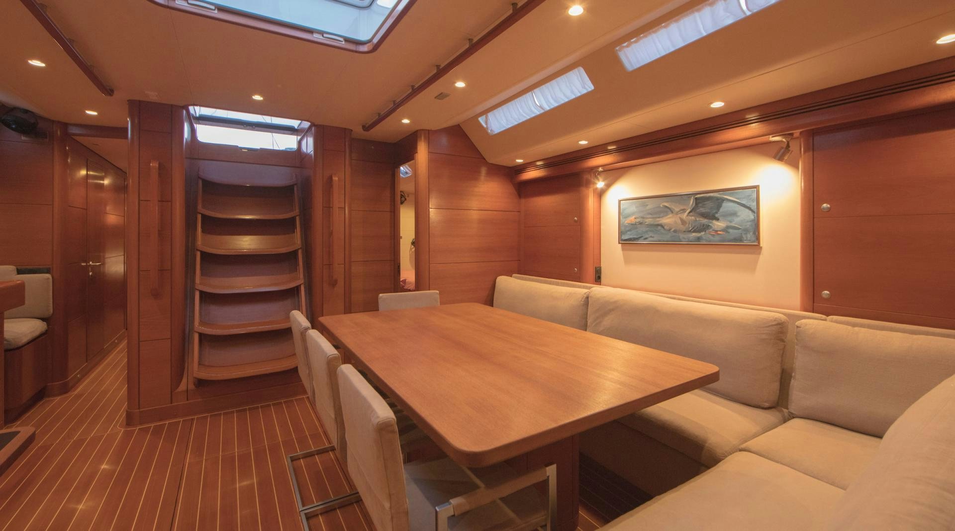 a room with a table and chairs aboard GREY GOOSE Yacht for Sale