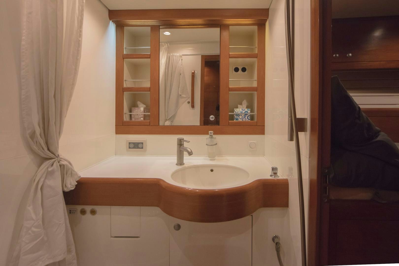 a bathroom with a sink and a mirror aboard GREY GOOSE Yacht for Sale