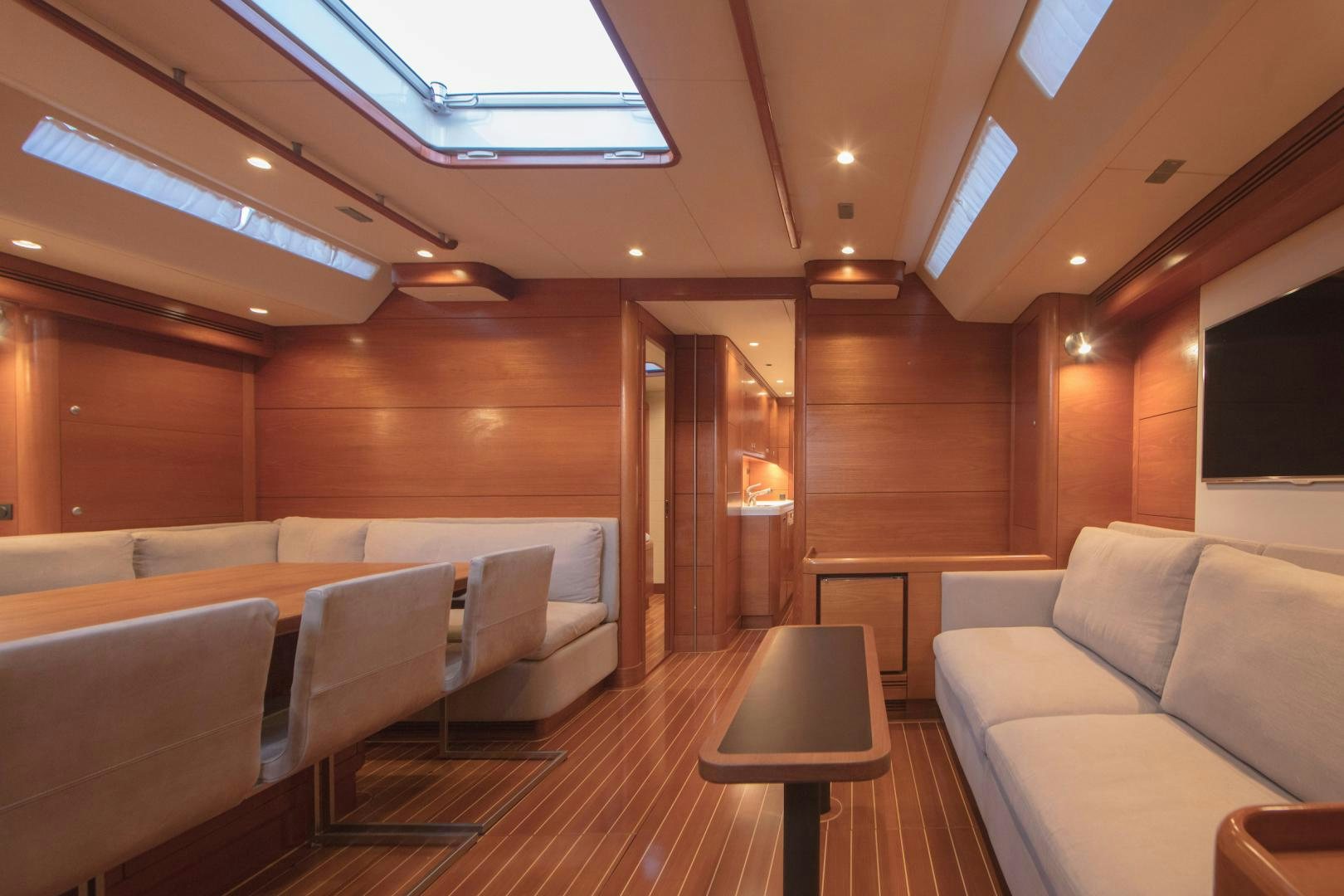 a room with couches and a table aboard GREY GOOSE Yacht for Sale