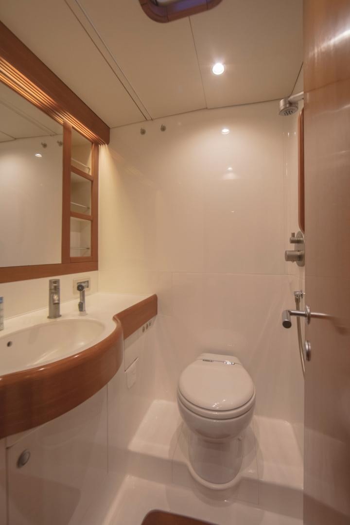 a bathroom with a toilet and sink aboard GREY GOOSE Yacht for Sale