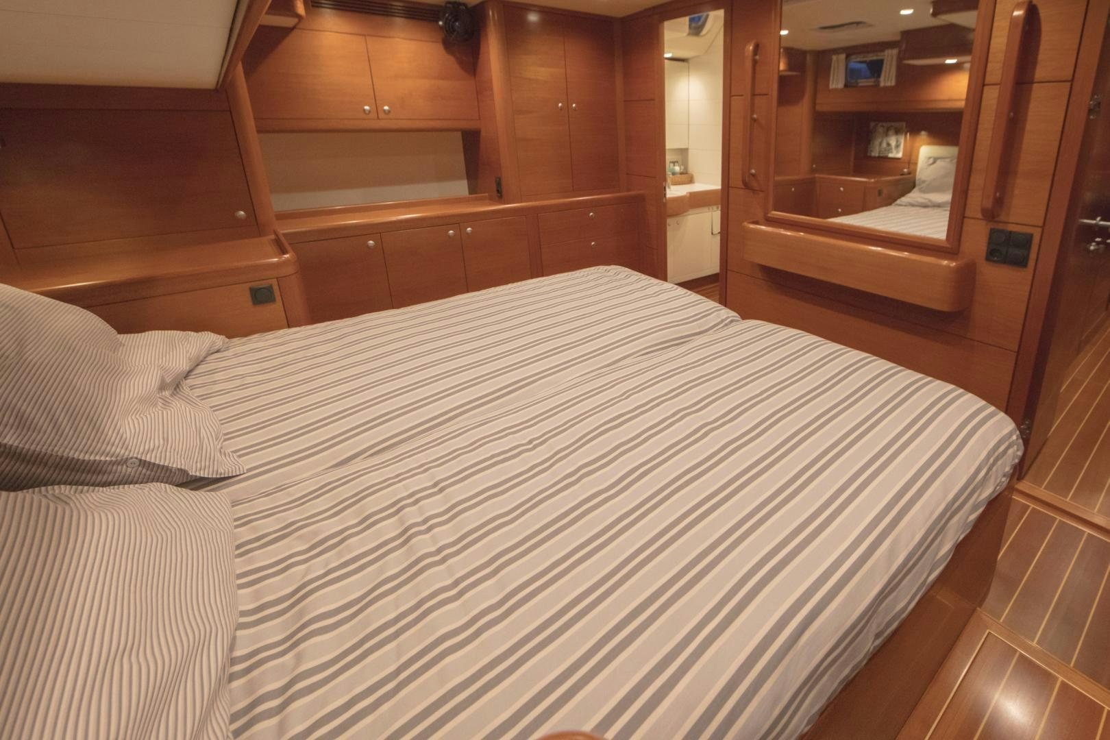 a bed in a room aboard GREY GOOSE Yacht for Sale