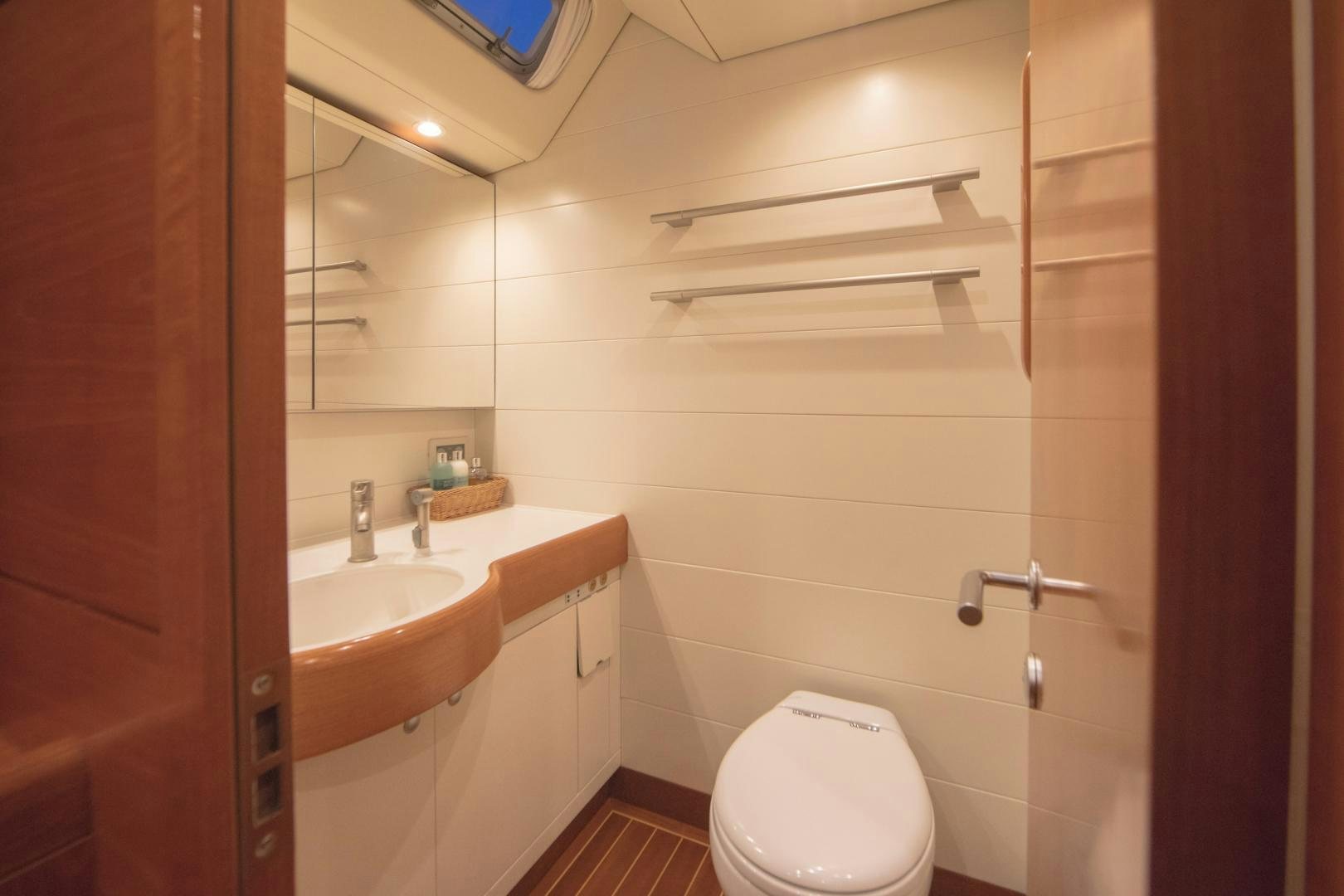 a bathroom with a toilet and sink aboard GREY GOOSE Yacht for Sale