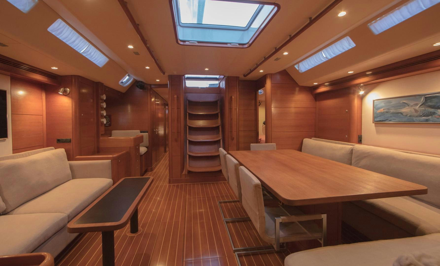 a room with a table and chairs aboard GREY GOOSE Yacht for Sale