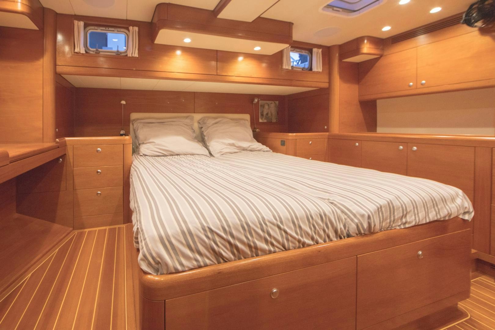 a room with a bed and a television aboard GREY GOOSE Yacht for Sale
