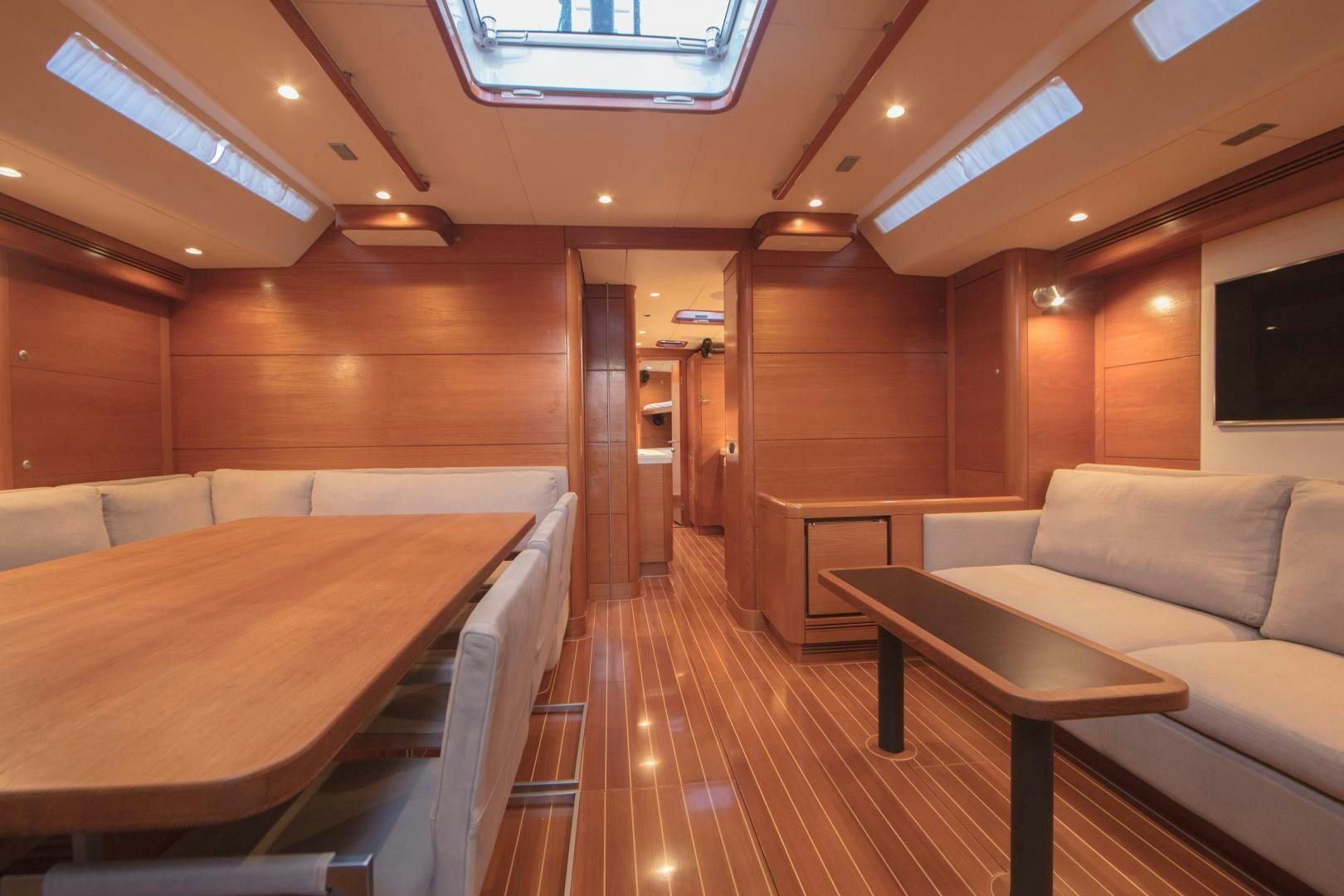 a room with a bed and a table aboard GREY GOOSE Yacht for Sale