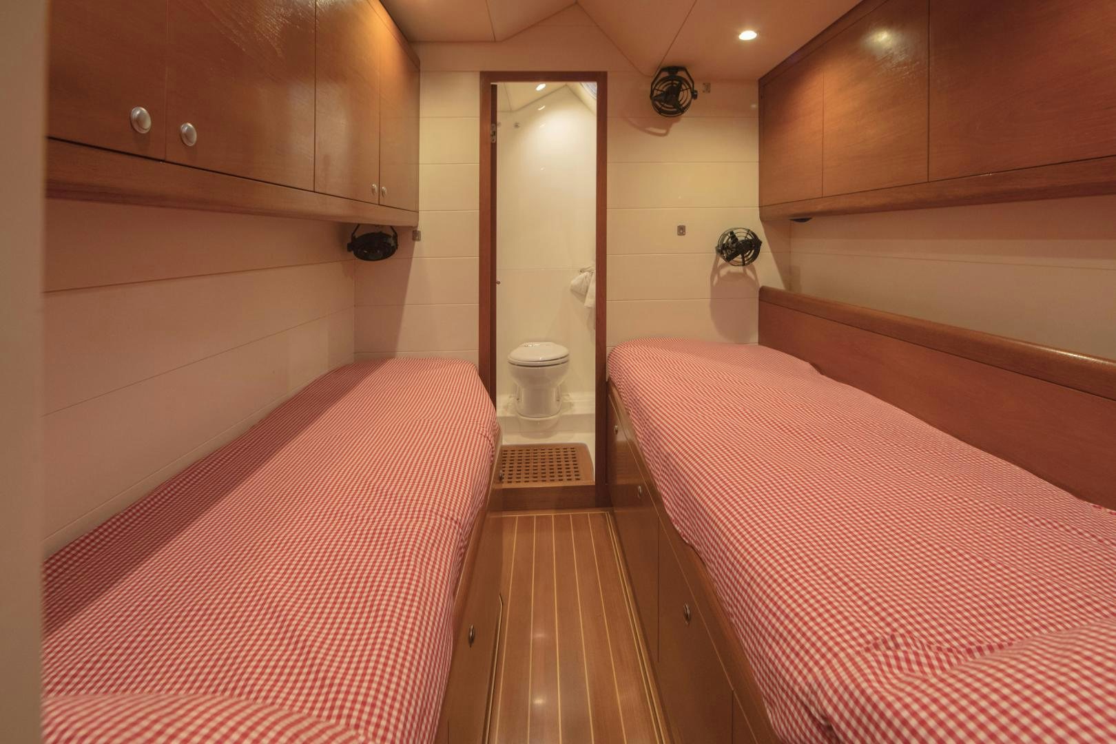 a room with a bed and a closet aboard GREY GOOSE Yacht for Sale