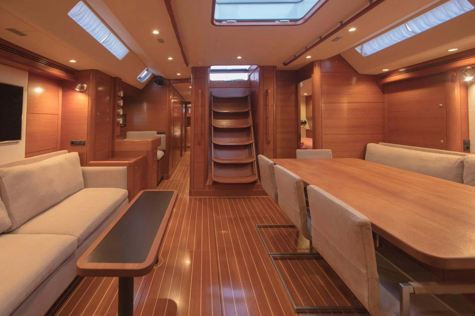 a room with tables and chairs aboard GREY GOOSE Yacht for Sale