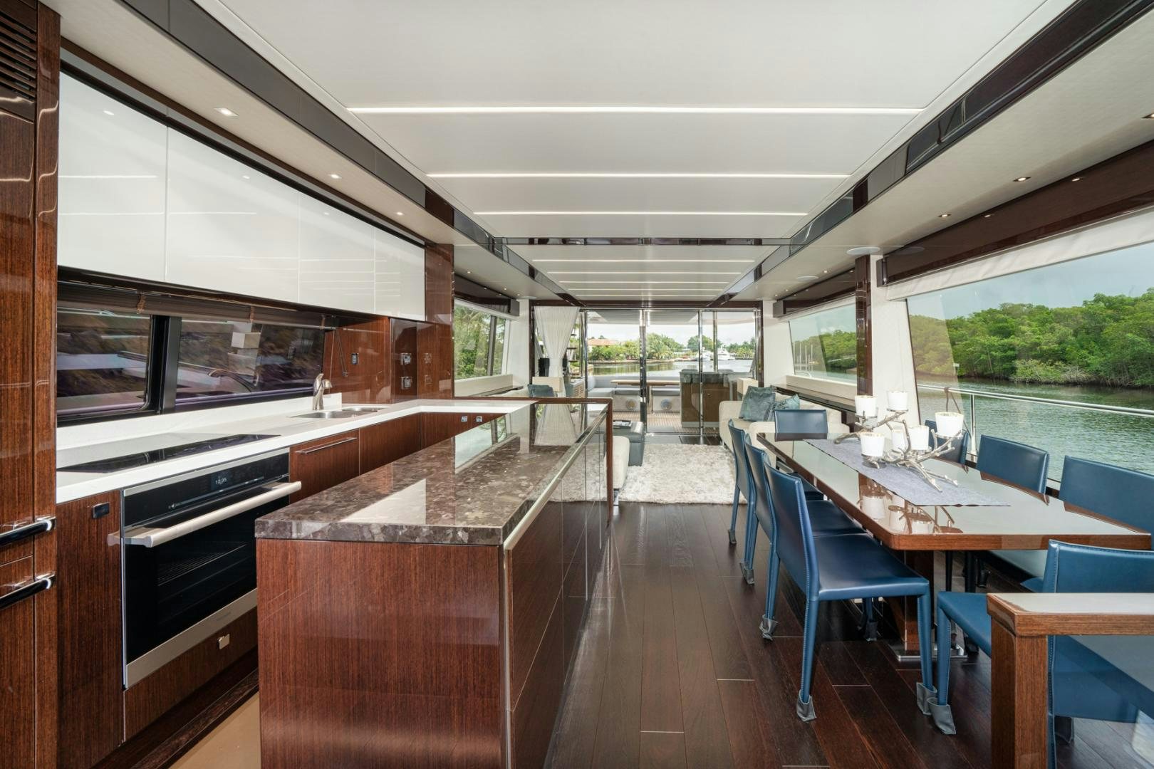 a room with tables and chairs aboard TEMPUS FUGIT Yacht for Sale