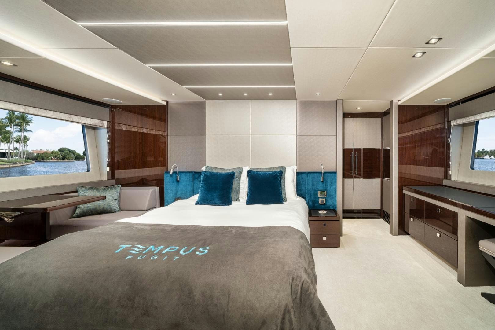 a room with a bed and a desk aboard TEMPUS FUGIT Yacht for Sale