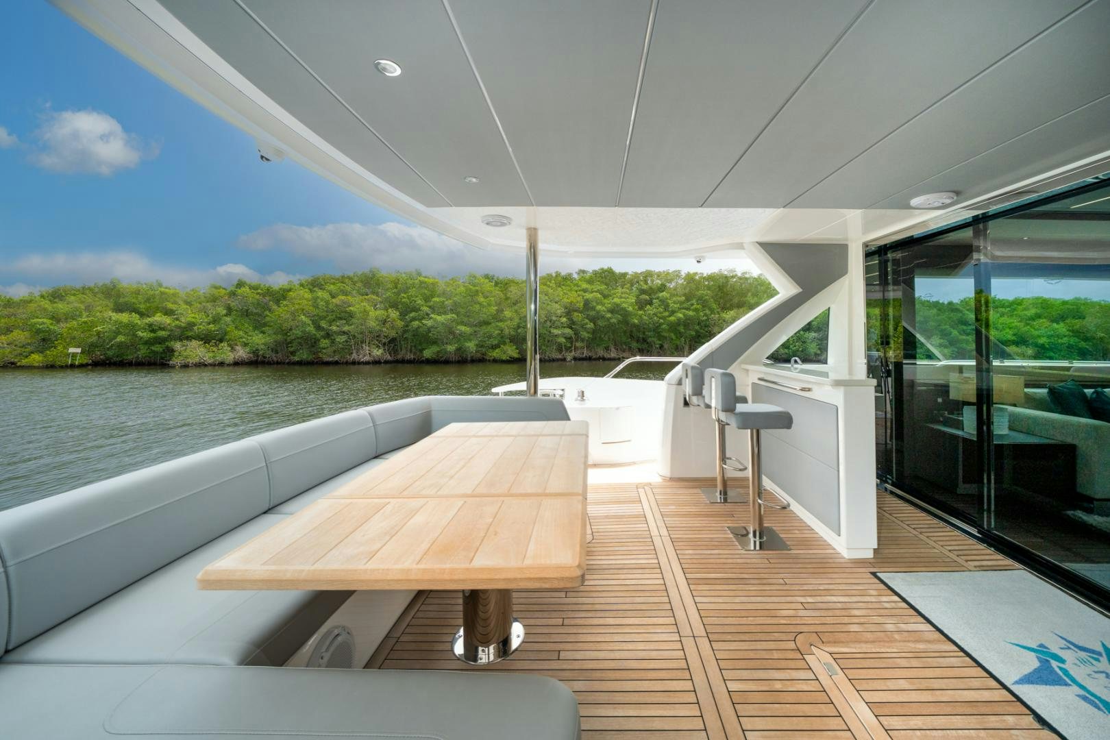 a wooden table on a deck aboard TEMPUS FUGIT Yacht for Sale