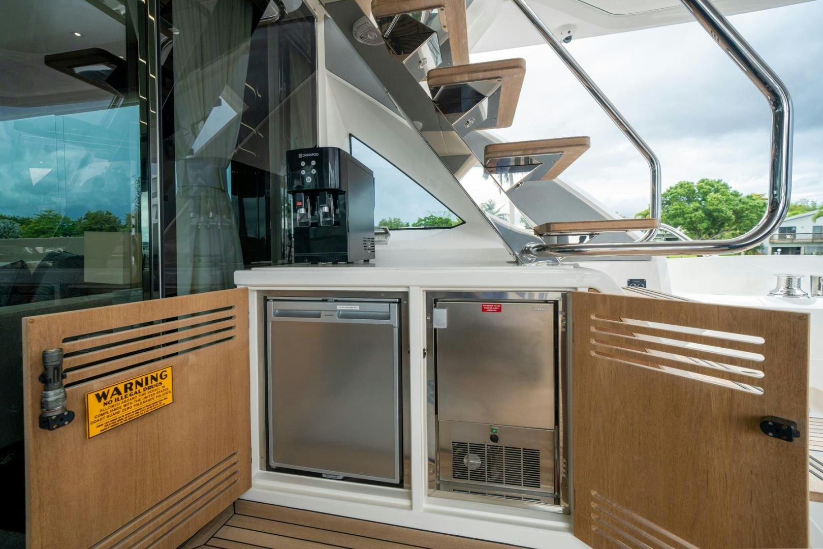 a kitchen with cabinets and a sink aboard TEMPUS FUGIT Yacht for Sale