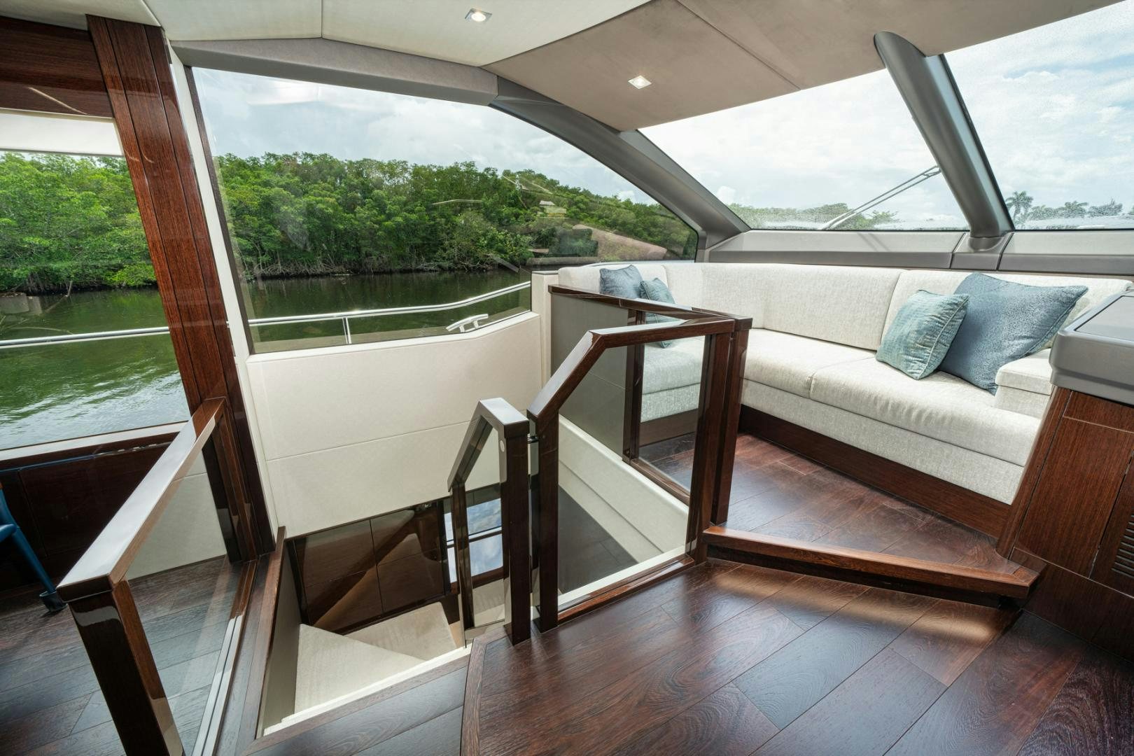 a room with a couch and a table and a window aboard TEMPUS FUGIT Yacht for Sale