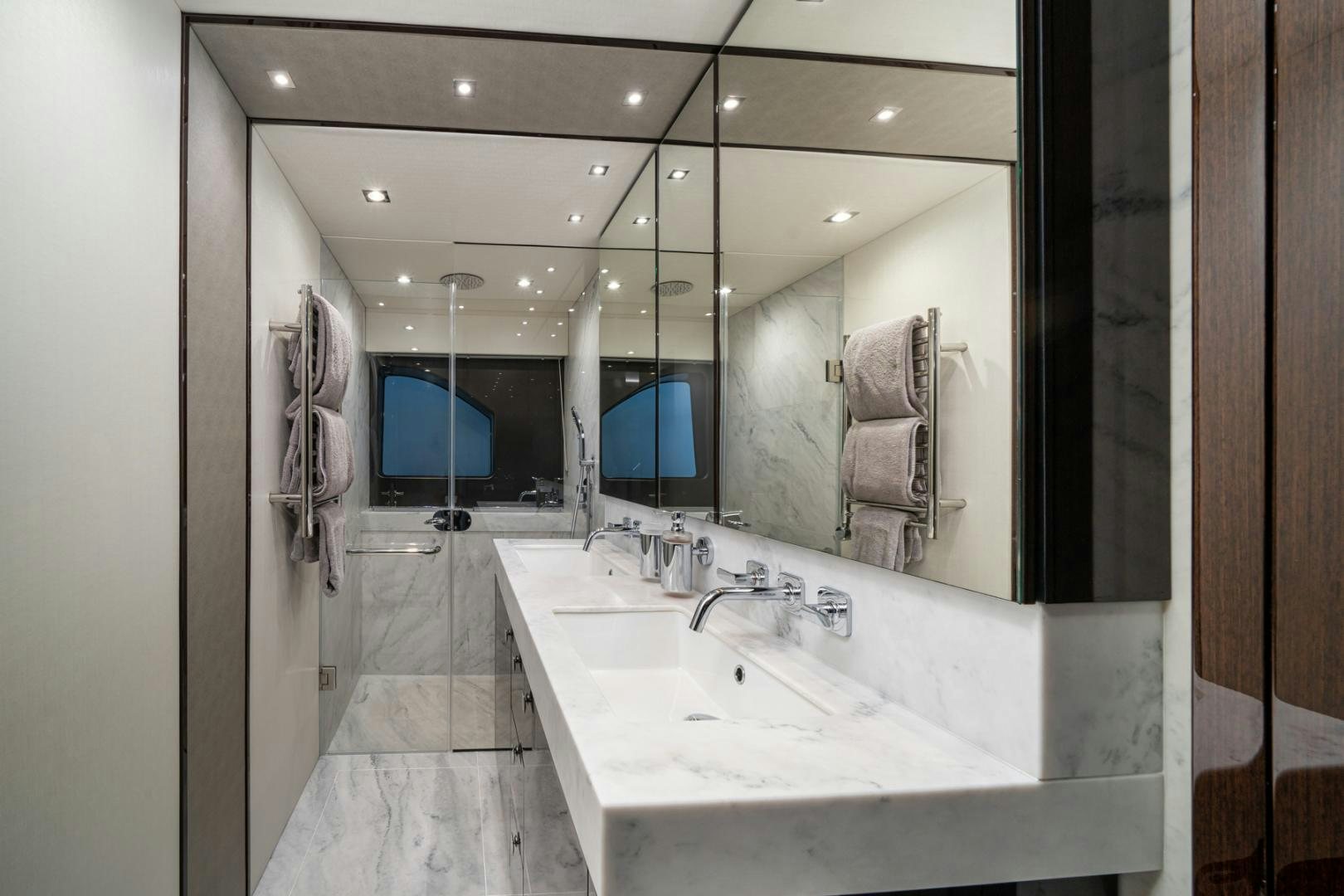 a bathroom with a large mirror aboard TEMPUS FUGIT Yacht for Sale