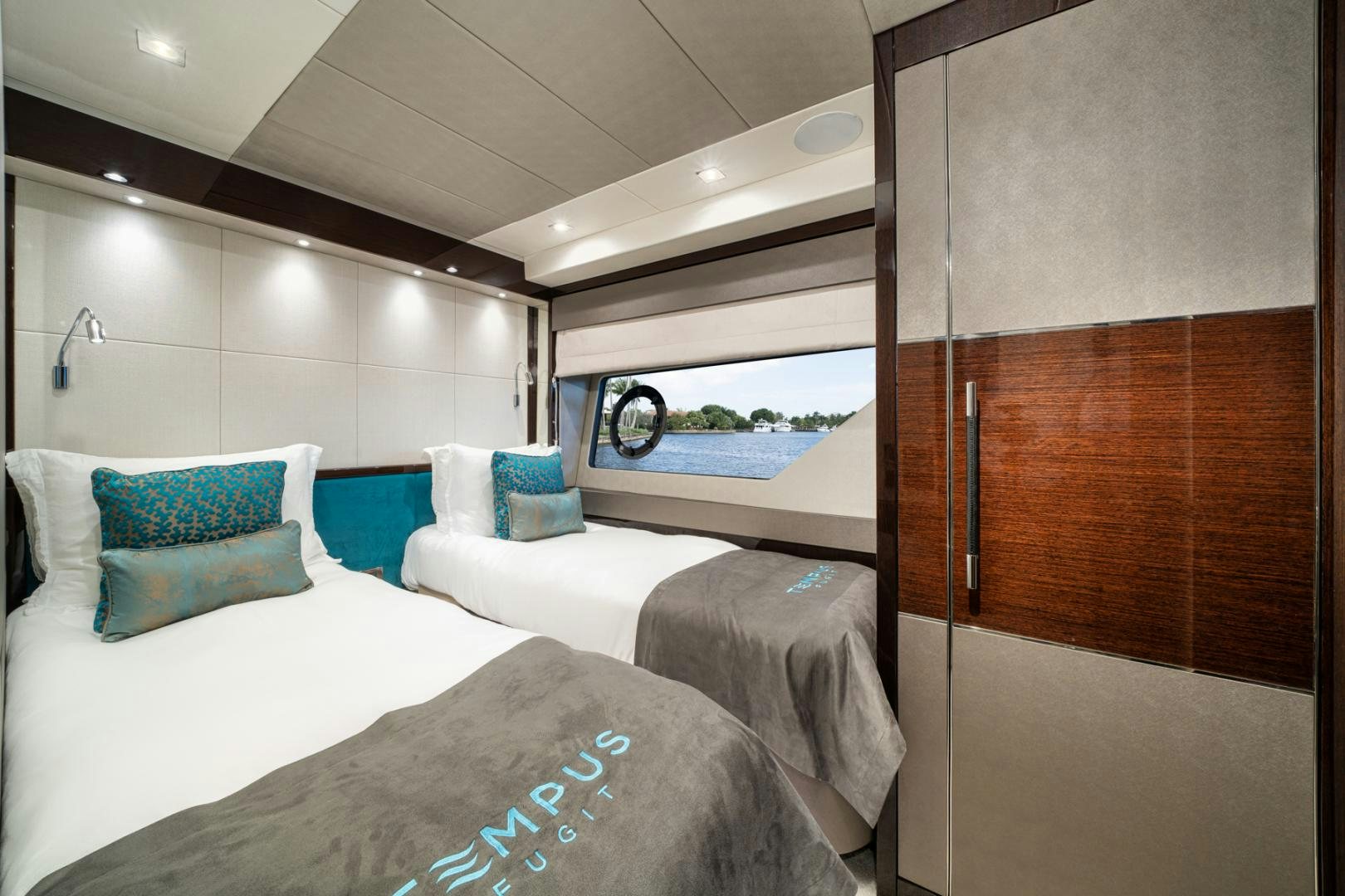a room with a bed and a window aboard TEMPUS FUGIT Yacht for Sale