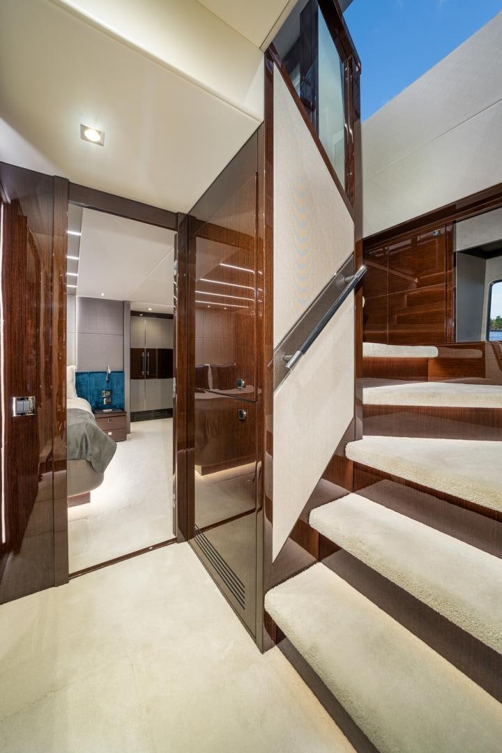 a hallway with a door and a bed aboard TEMPUS FUGIT Yacht for Sale