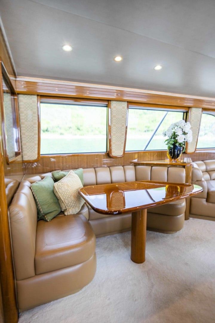 a living room with a couch and a table aboard TRANQUILO Yacht for Sale