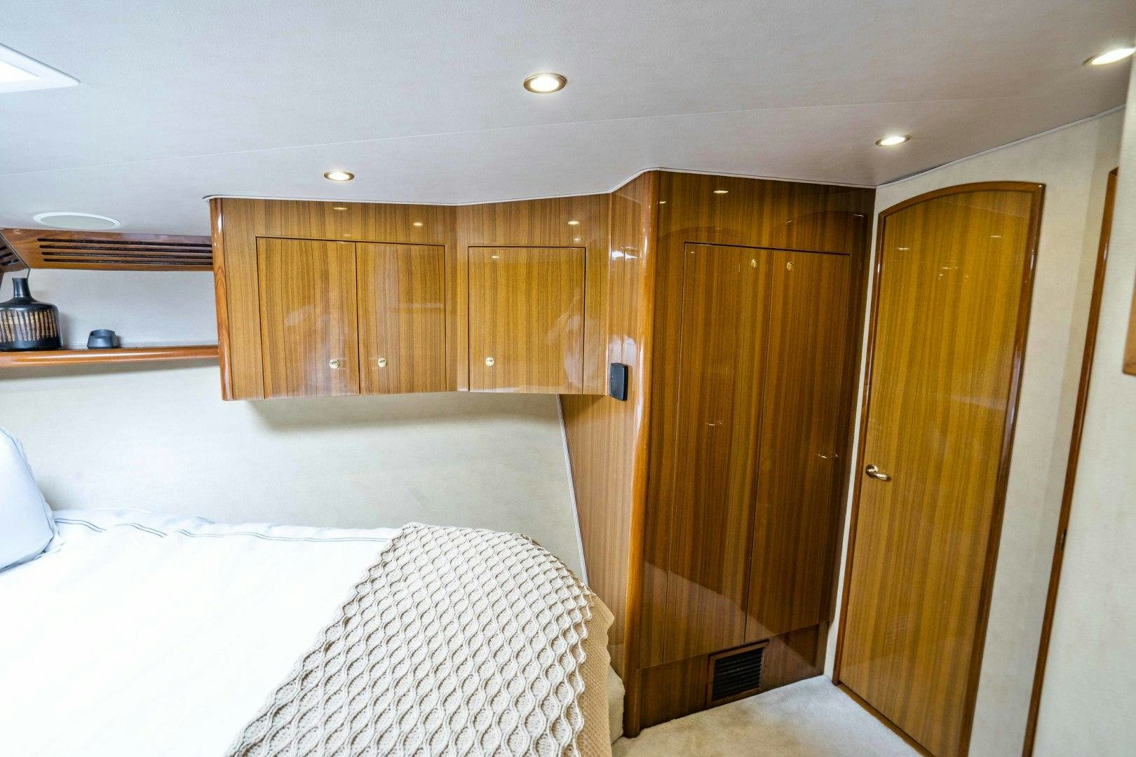 a room with wooden cabinets aboard TRANQUILO Yacht for Sale