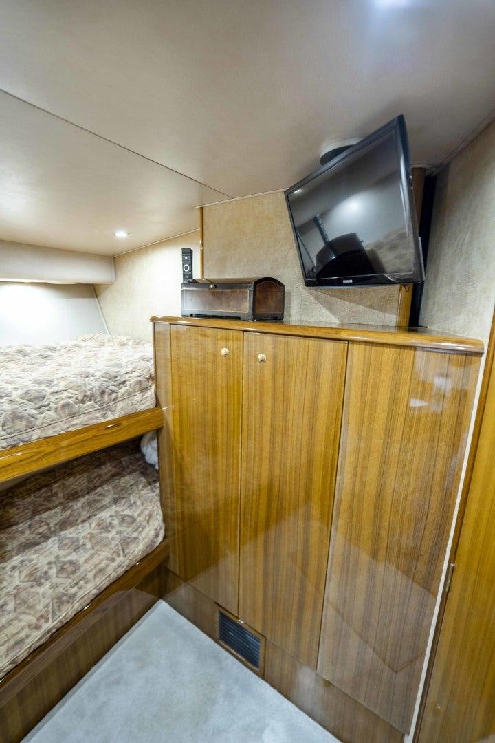 a tv on a cabinet aboard TRANQUILO Yacht for Sale