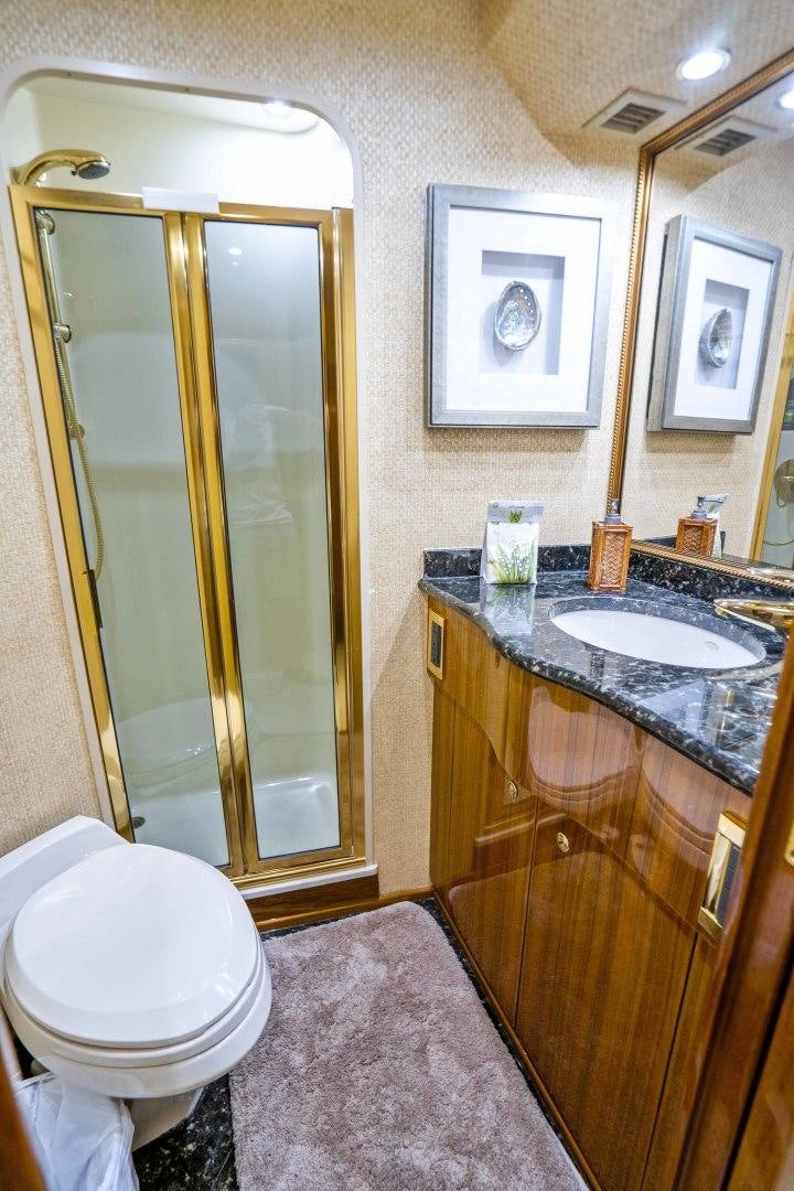 a bathroom with a sink and a toilet aboard TRANQUILO Yacht for Sale