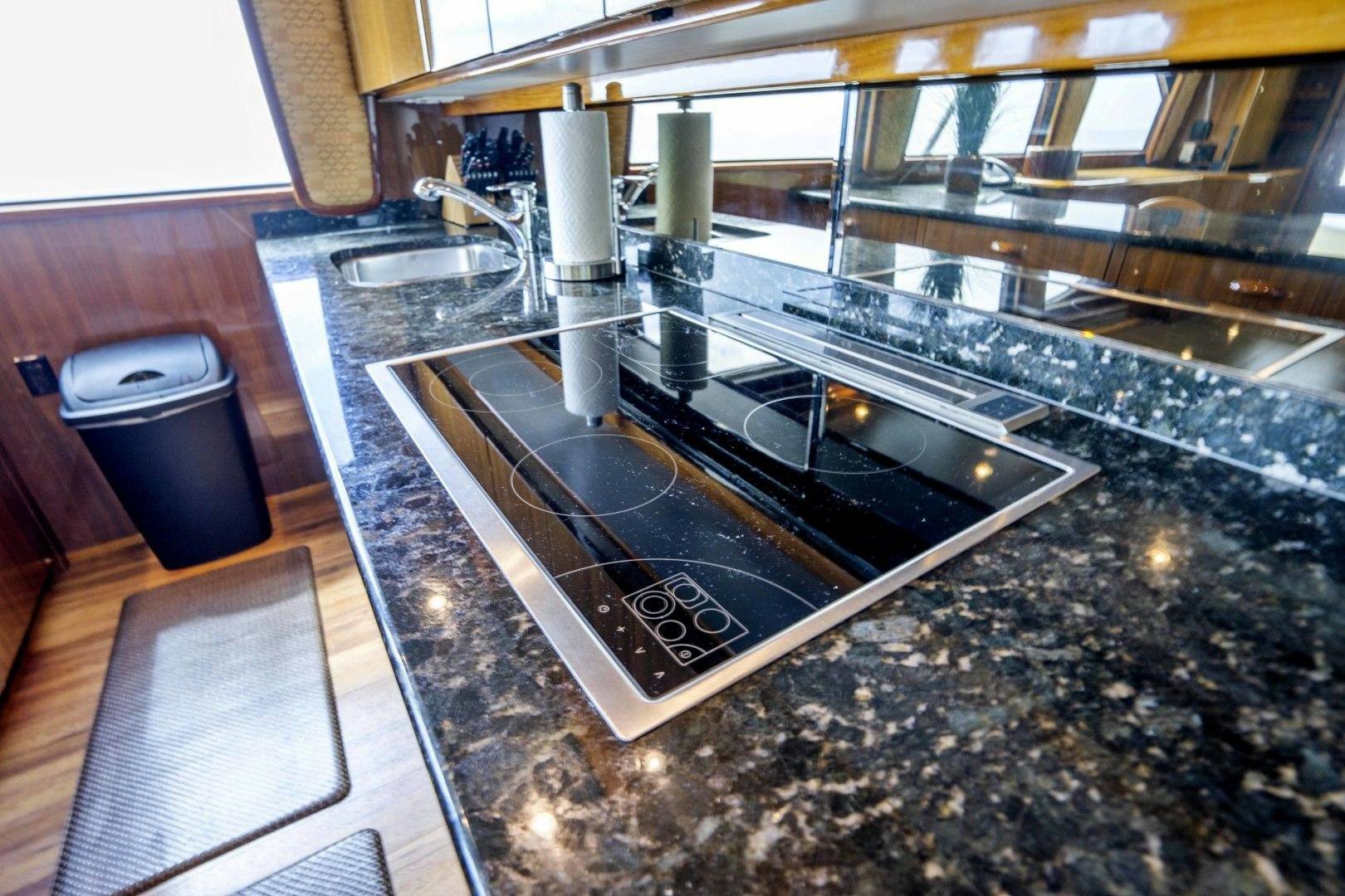 a large kitchen with a large stainless steel sink aboard TRANQUILO Yacht for Sale