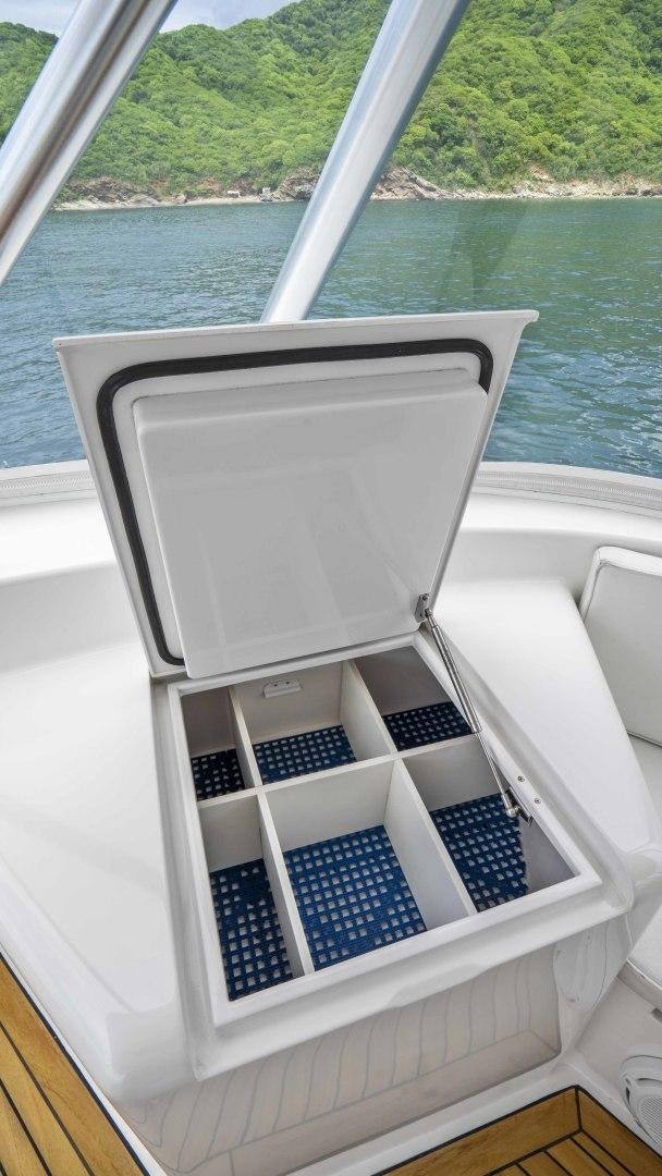 a boat with a blue stripe aboard TRANQUILO Yacht for Sale