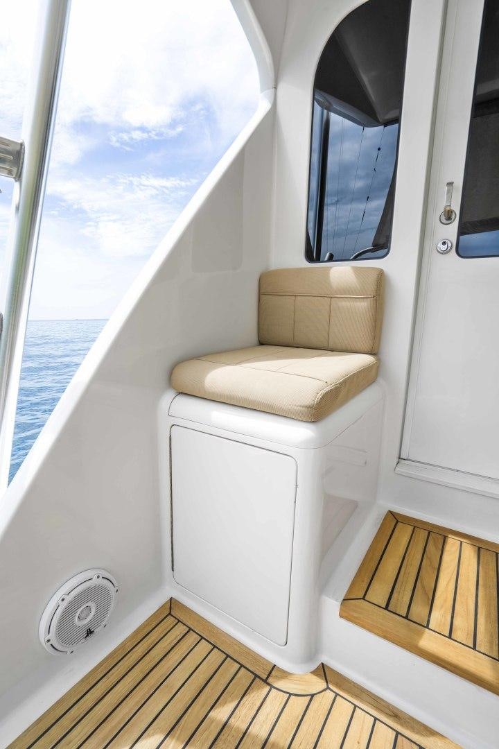 a room with a couch and a large window aboard TRANQUILO Yacht for Sale