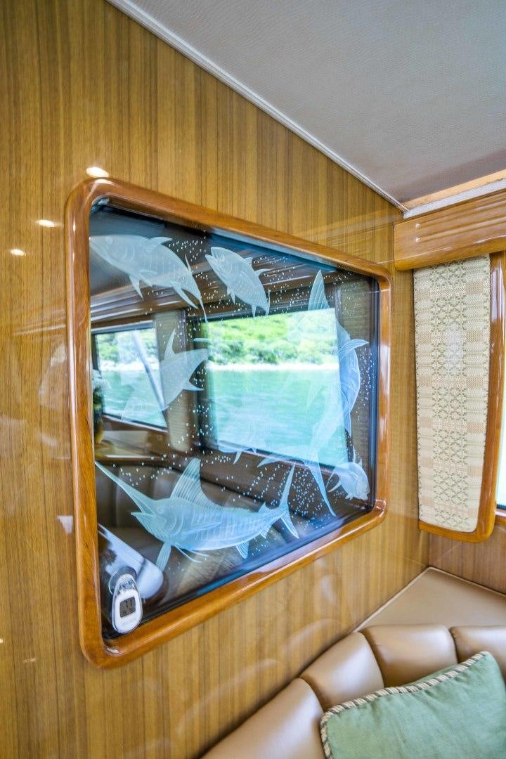 a window with a fish tank aboard TRANQUILO Yacht for Sale